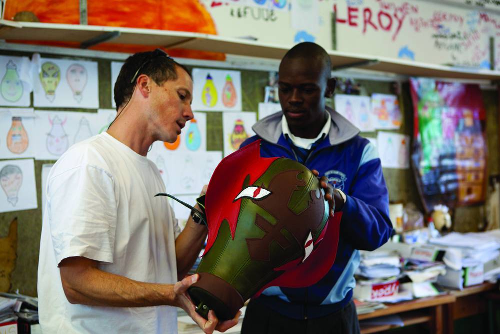 Amukelo Ngobeni from Isilimela High School discuss his punching bag design with Johann.