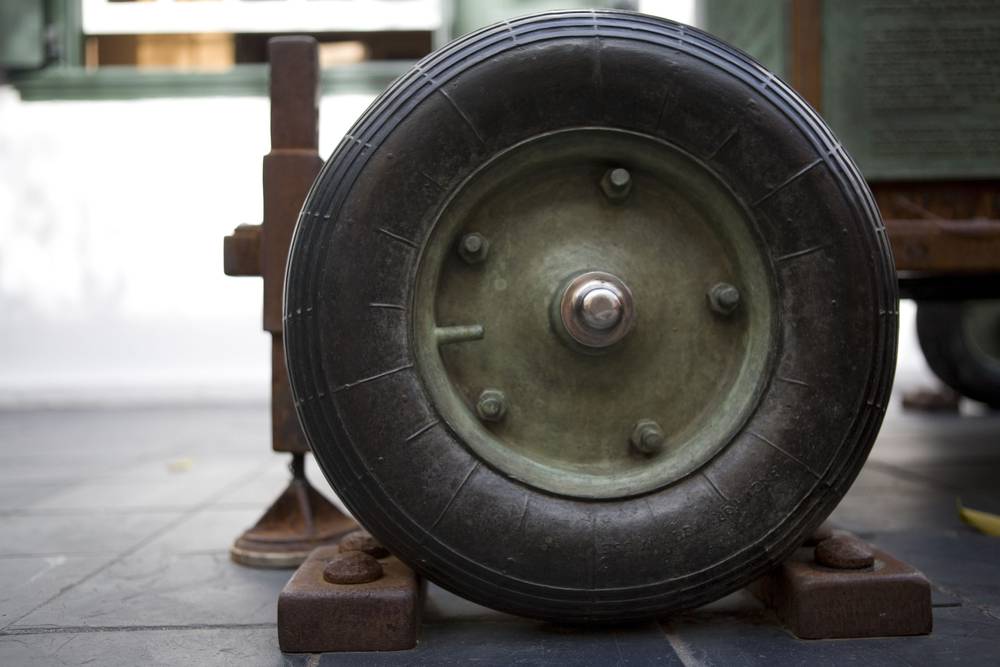 A close up of one of the bronze wheels of the AWP