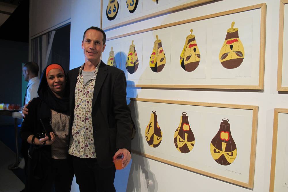 Participating learner in front of her punch bag collage.