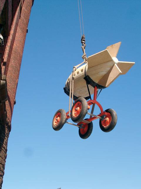 Bomb being lifted into the studio after computer aided manufactured parts have been assembled in the factory