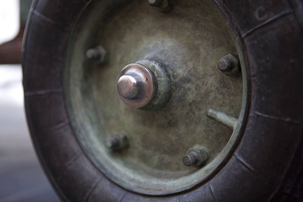 A close up of one of the bronze wheels of the AWP