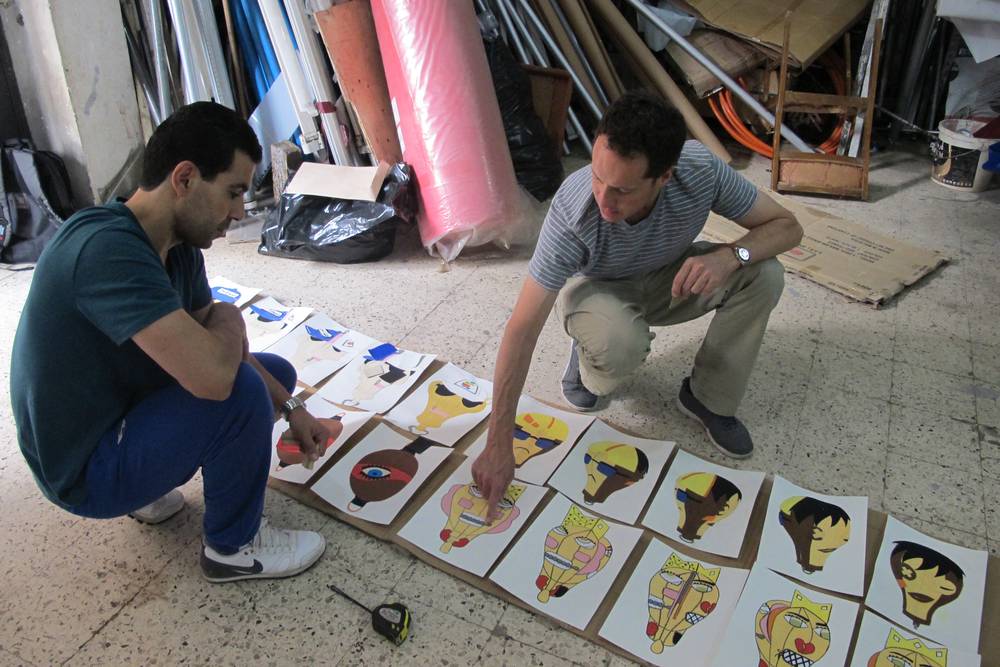 Johann discussing designs with leather a local Algerian leather craftsman.